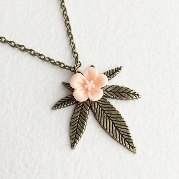  weed jewelry with pink rose in the middle brass 