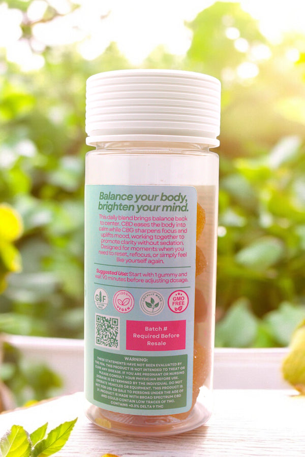 Supplement bottle with a green label on a blurred natural background