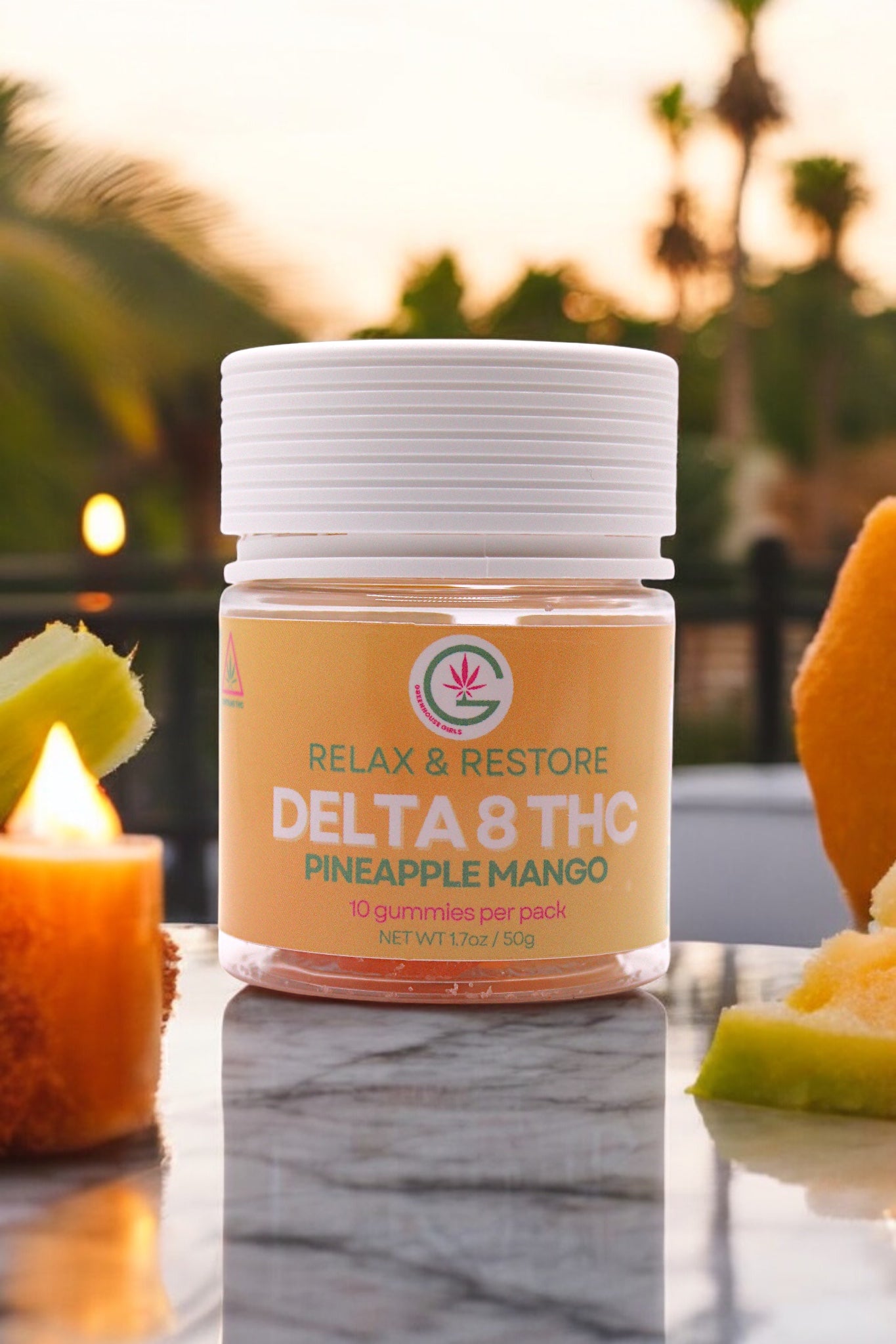 Jar of Delta 8 THC gummies with pineapple mango flavor on a table outdoors.