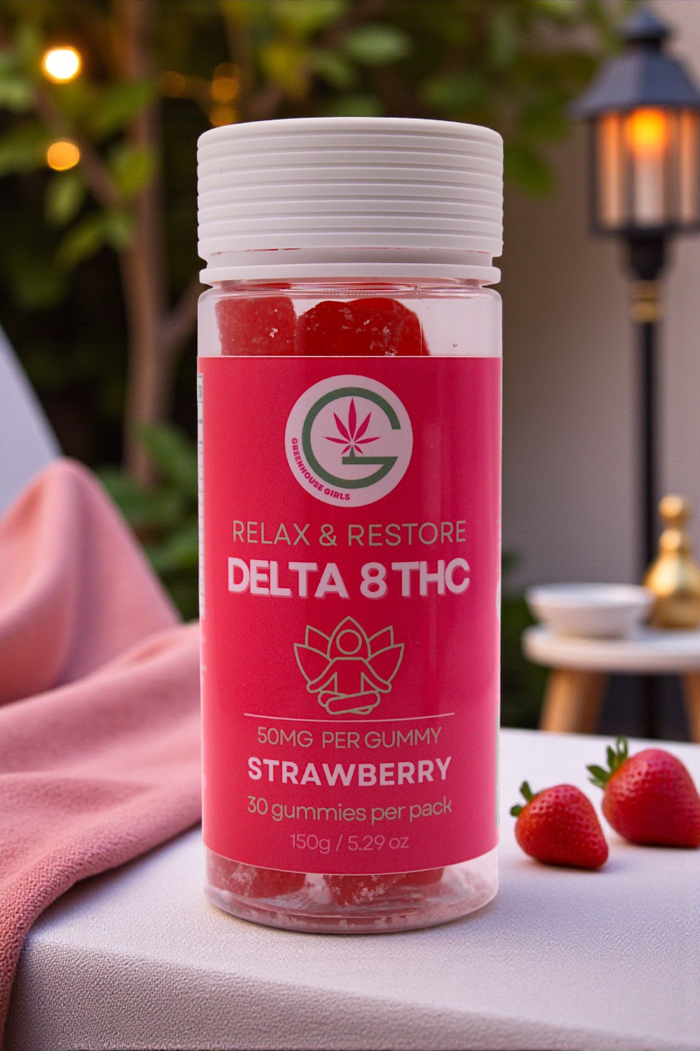 Bottle of Delta 8 THC gummies with a pink label on a table outdoors.