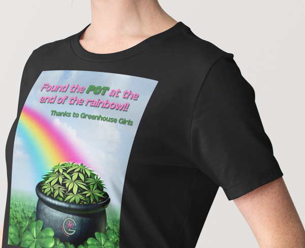 Black t-shirt with a graphic of a pot with plants and rainbow, worn by a person.